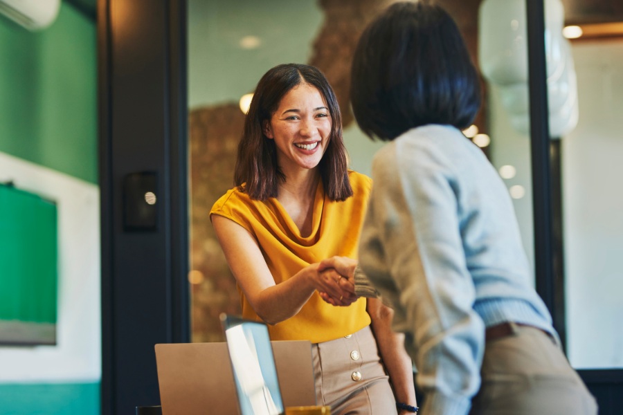 Hawaii business owner shaking hands with insurance agent